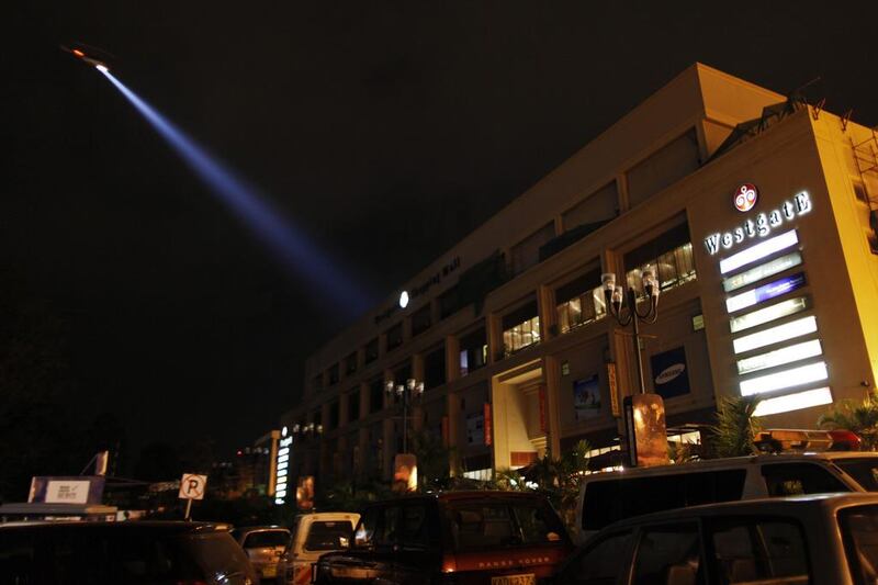 A police helicopter hovers over the Westgate mall in search of suspects. Dai Kurokawa / EPA