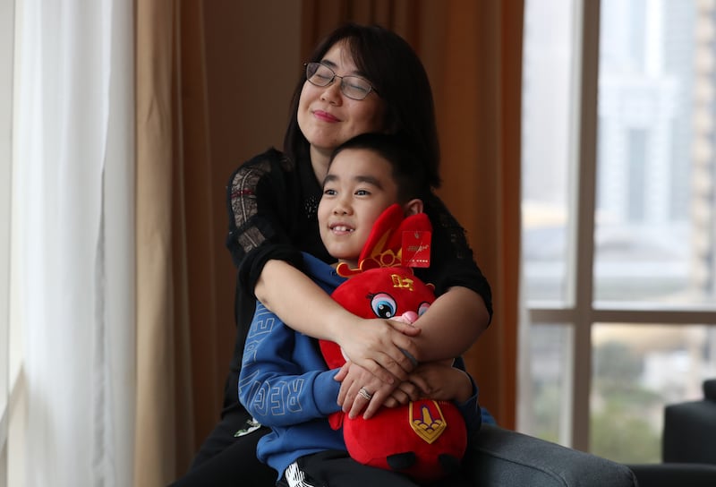 Chinese mum  Wu Zixuan and her son Ming have moved to Dubai from Beijing so the family can be together. Chris Whiteoak / The National