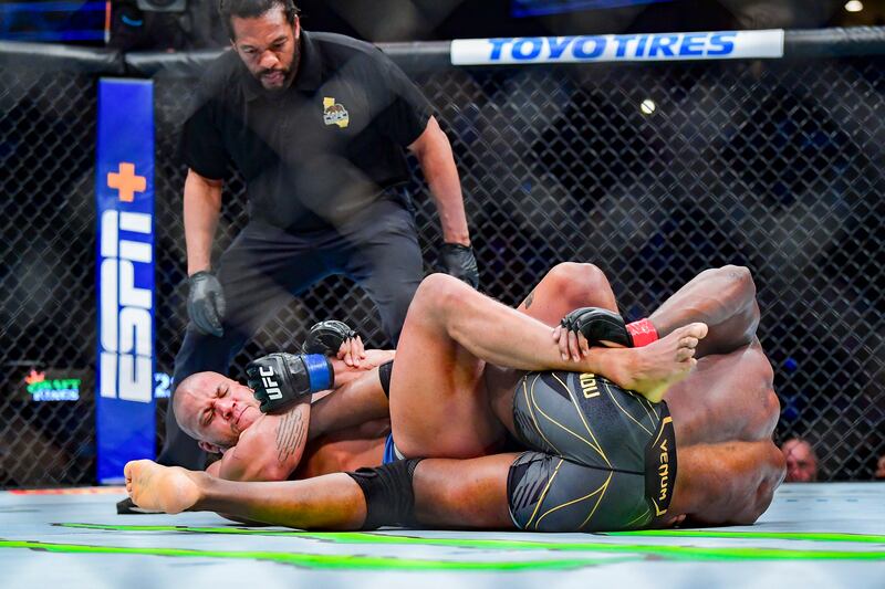 Francis Ngannou and Ciryl Gane (attempt to lock each other during their heavyweight title bout at UFC 270. USA TODAY Sports