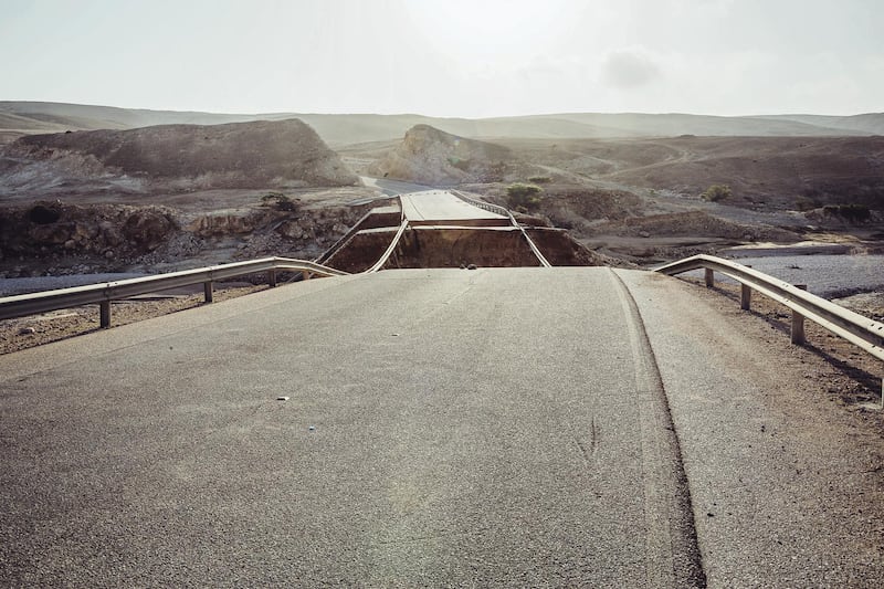 High country road, heading towards Highway 31, above Salalah, a popular spot for tourists and camel farmers. A huge section of this bridge was washed away in the storm. Antony Hansen for The National