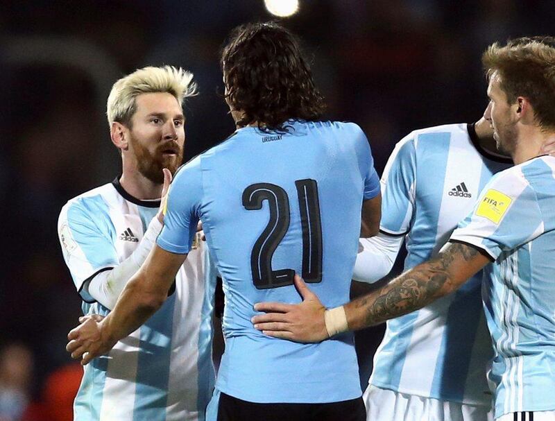 Argentina’s Lionel Messi shakes hands with Uruguay’s Edinson Cavani at the end of the match. Marcos Brindicci / Reuters