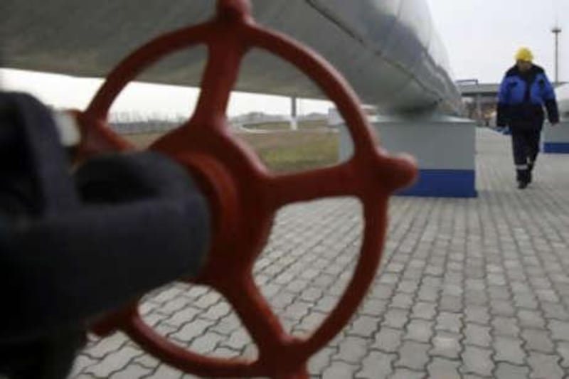 A Gazprom worker walks next to pipelines at a gas measuring station at the Russian-Ukrainian border in Sudzha near Kursk, some 500km south of Moscow.