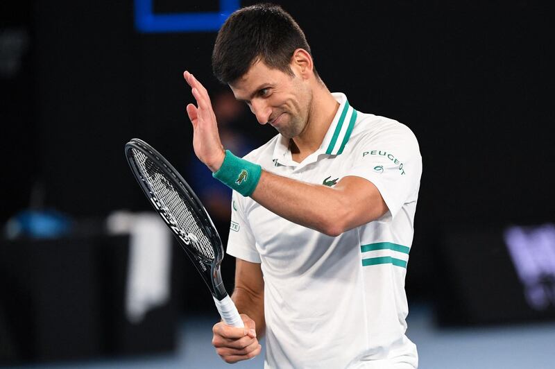 Novak Djokovic applauds a Daniil Medvedev shot. AFP