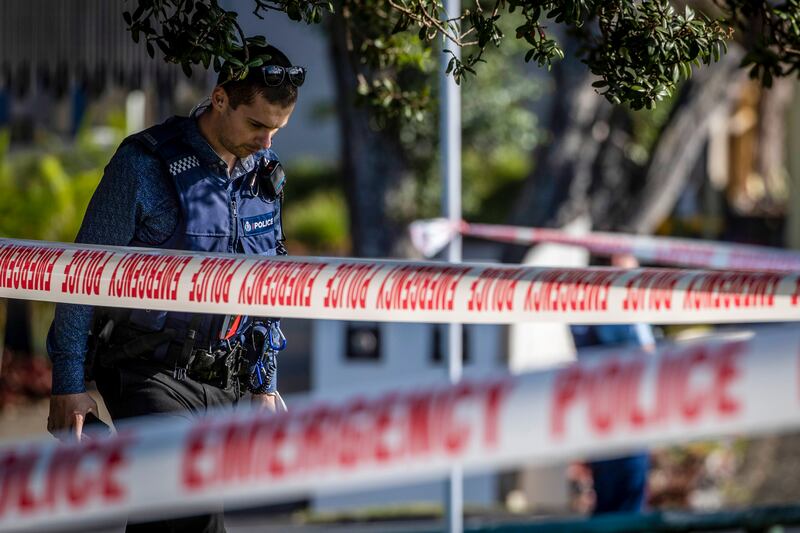 Police set up a cordon and search area in a suburb of Auckland following reports of multiple stabbings in New Zealand on Thursday, June 23. AP