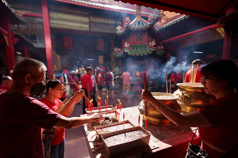 Malaysian ethnic Chinese pray on the first day of Lunar New Year's holidays at a temple in Kuala Lumpur, Malaysia. AP Photo