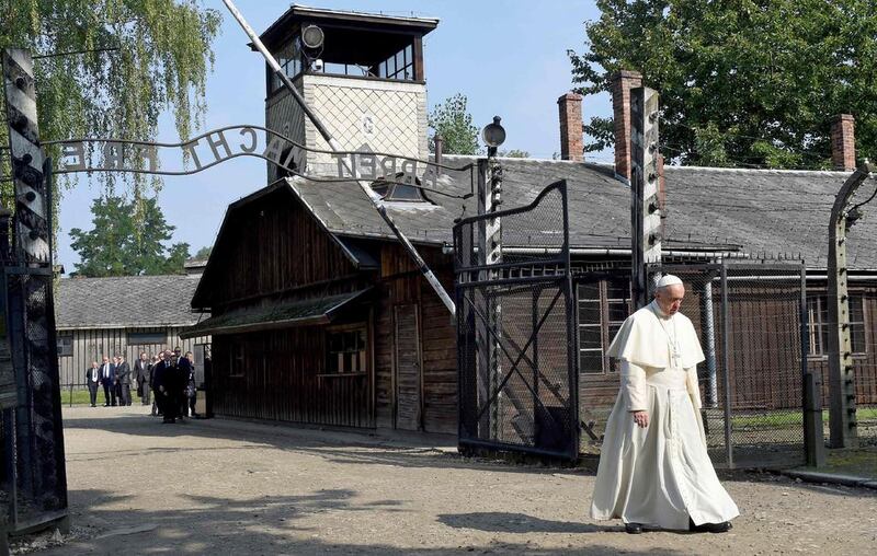 Pope Francis  walks through the entrance of the former Nazi death camp of Auschwitz in Oswiecim, Poland  on a visit to the Nazi concentration camp Auschwitz-Birkenau 29 July, 2016.  Janek Skarzynski / AFP 

