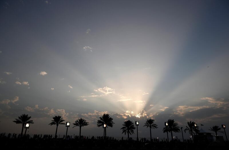 A sunset is seen over a track prior to the Grand Prix. AP Photo