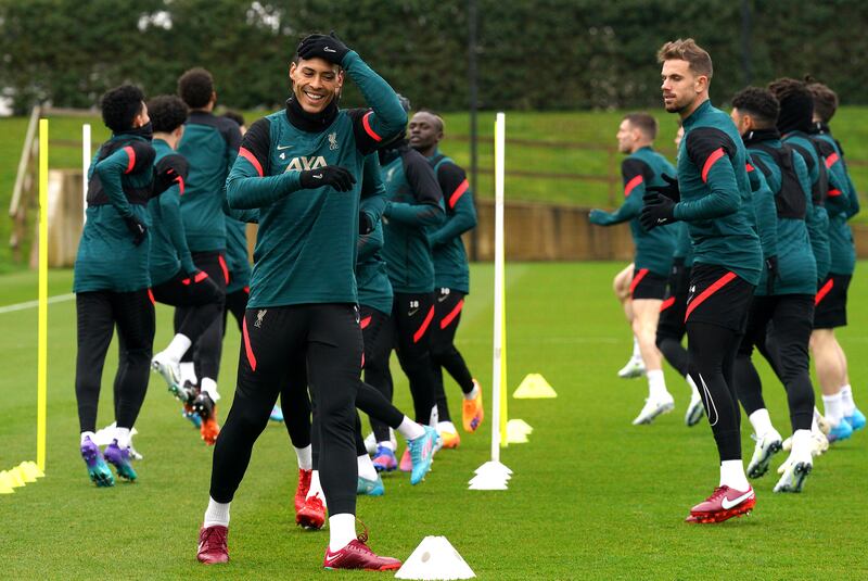 Liverpool's Virgil van Dijk, left, and Jordan Henderson during training. PA