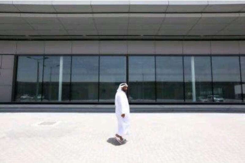 A work in progress: Ahmed Salem Al Mansoori checks on the status of his dealership’s new air-conditioned showroom at Motor World near Abu Dhabi airport last week.