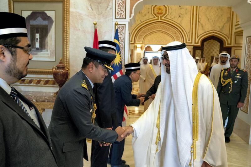 ABU DHABI, UNITED ARAB EMIRATES - June 14, 2019: HH Sheikh Mohamed bin Zayed Al Nahyan, Crown Prince of Abu Dhabi and Deputy Supreme Commander of the UAE Armed Forces (R) bids farewell to members of the delegation accompanying HM King Sultan Abdullah Sultan Ahmad Shah of Malaysia (not shown), at the Presidential Airport.

( Hamad Al Kaabi / Ministry of Presidential Affairs )​
---