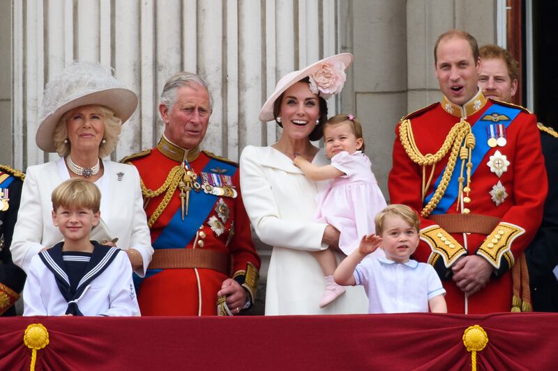 Camilla, Duchess of Cornwall, Prince Charles, Kate, Princess Charlotte, Prince George and Prince William watch a flypast during the Trooping the Colour at Buckingham Palace in June 2016.