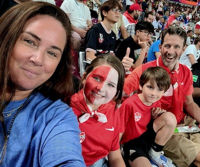 Jay French, an ex-professional football player, watches the Canada v Croatia match on Sunday night in Doha with his family -  Kirrily French, Taylor French, aged 10, and Kingsley French, aged seven. Photo: French family