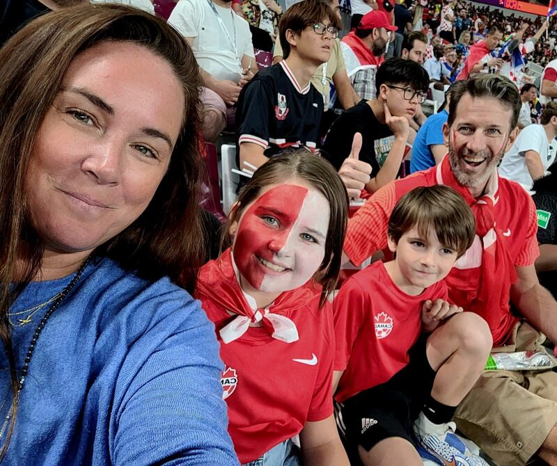 Jay French, an ex-professional football player, watches the Canada v Croatia match with his family. Now a Dubai-based businessman, he is taking part in the Screening Cognitive Outcomes after Repetitive head impact Exposure research at the University of East Anglia. Photo: French family