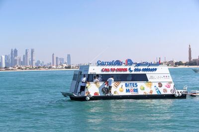 DUBAI, UNITED ARAB EMIRATES. 12 DECEMBER 2018. Trying out the new floating Carrefour mini market off the coast of Dubai. Dubai resident Marie Byrne takes her yacht out to try the new Carrefour floating shop. The floating shop has a nr on the side that sailors can call to get deliveries or their boat /yacht can come alongside to purchase items. (Photo: Antonie Robertson/The National) Journalist: Nicke Webster. Section: National.