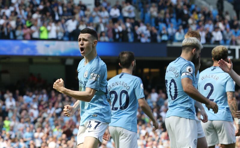 epa07517289 Manchester City's Phil Foden (L) celebrates scoring a goal during the English Premier League soccer match between Manchester City and Tottenham Hotspur at the Etihad Stadium in Manchester, Britain, 20 April 2019.  EPA/NIGEL RODDIS EDITORIAL USE ONLY. No use with unauthorized audio, video, data, fixture lists, club/league logos or 'live' services. Online in-match use limited to 120 images, no video emulation. No use in betting, games or single club/league/player publications.