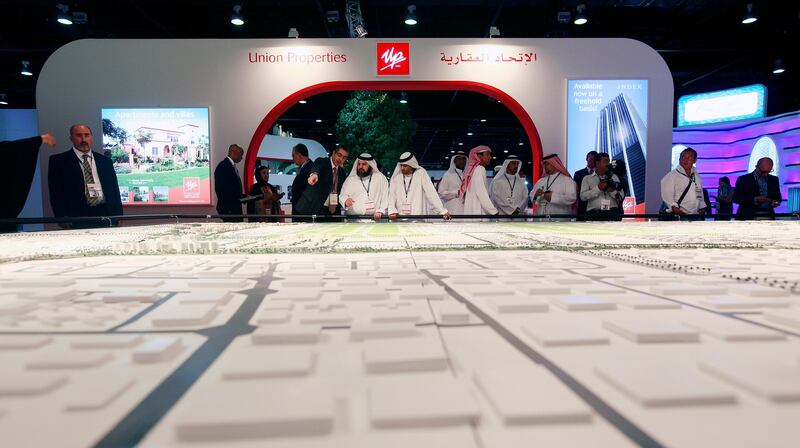 Dubai , United Arab Emirates- September 27,  2011:    Visitors browse the  Union Properties Projects  at  the Cityscape Global in Dubai.  ( Satish Kumar / The National ) For Business