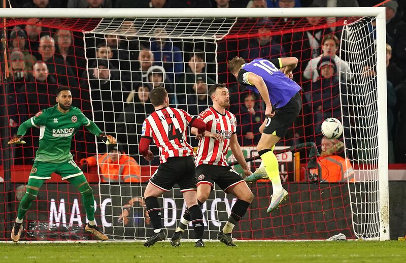 Tottenham Hotspur's Harry Kane, right, heads wide of the goal during the FA Cup fifth round match at Bramall Lane. PA