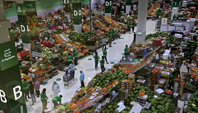 People shop for fresh food and vegetables as they prepare for Ramadan. AFP