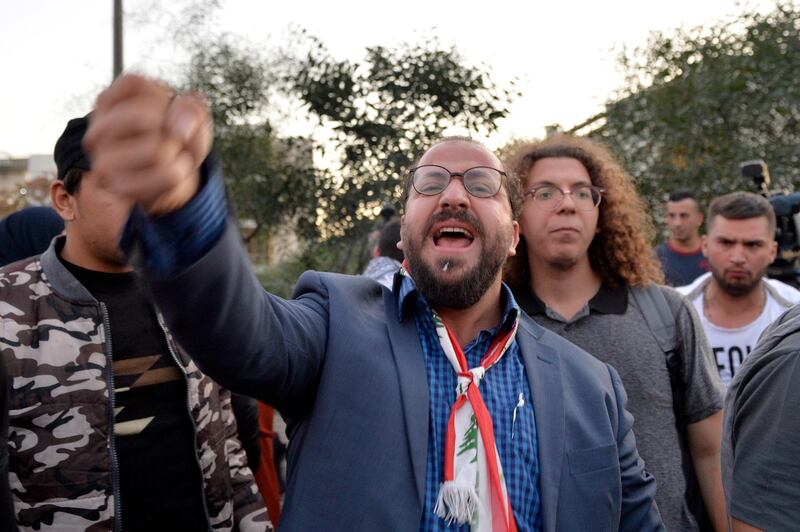 Protesters shout slogans as they block the highway leading to the Presidential palace during a protest to demand the formation of a new government in Baabda.  EPA