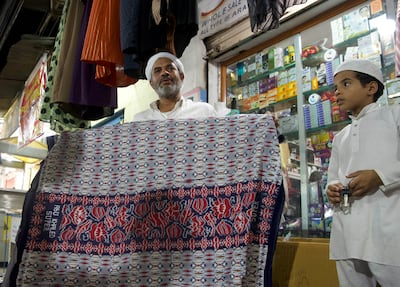 Khalid bin Hussain Wahlan, 44, is a third-generation Yemeni living in India. He sells traditional Yemeni loincloth futah at Barkas. Taniya Dutta / The National