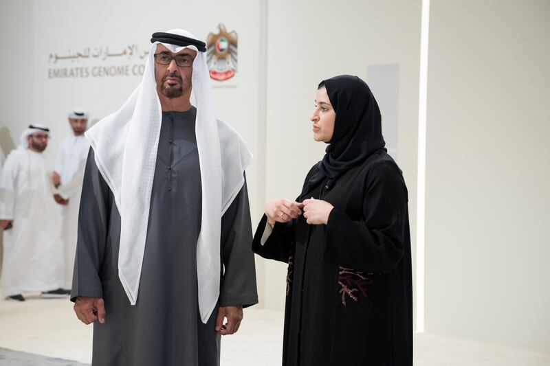 President Sheikh Mohamed listens to a presentation by Sarah Al Amiri, UAE Minister of State for Public Education and Advanced Technology, at the launch of the National Genome Strategy. Hamad Al Kaabi /  UAE Presidential Court