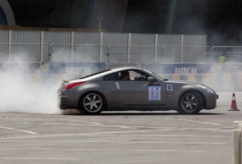 Mark Luney of Belfast drifts a Nissan 350z at the Barbican Turbo Show in Abu Dhabi.