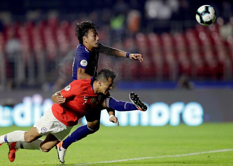 Alexis Sanchez heads in Chile's third goal, his first for five months. EPA
