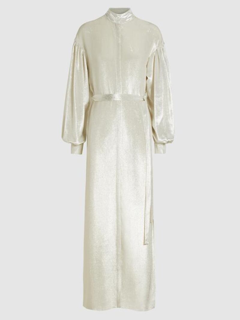 Woman in white: Regency lamé maxi dress by Osman; Dh4,460. Courtesy The Modist