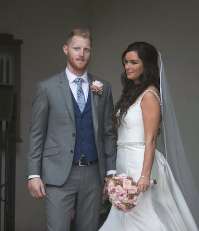 England cricket team all-rounder Ben Stokes poses with his bride Clare, outside St Mary the Virgin church in East Brent, England, Saturday Oct. 14, 2017.  Among the wedding guests were current England Test captain Joe Root, former captain Alistair Cook. (Steve Parsons/PA via AP)