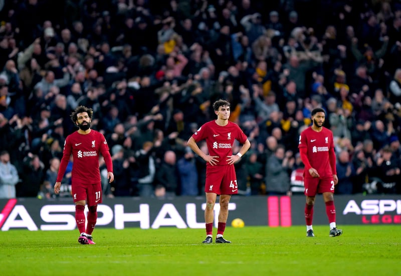 Liverpool players after the third goal. PA