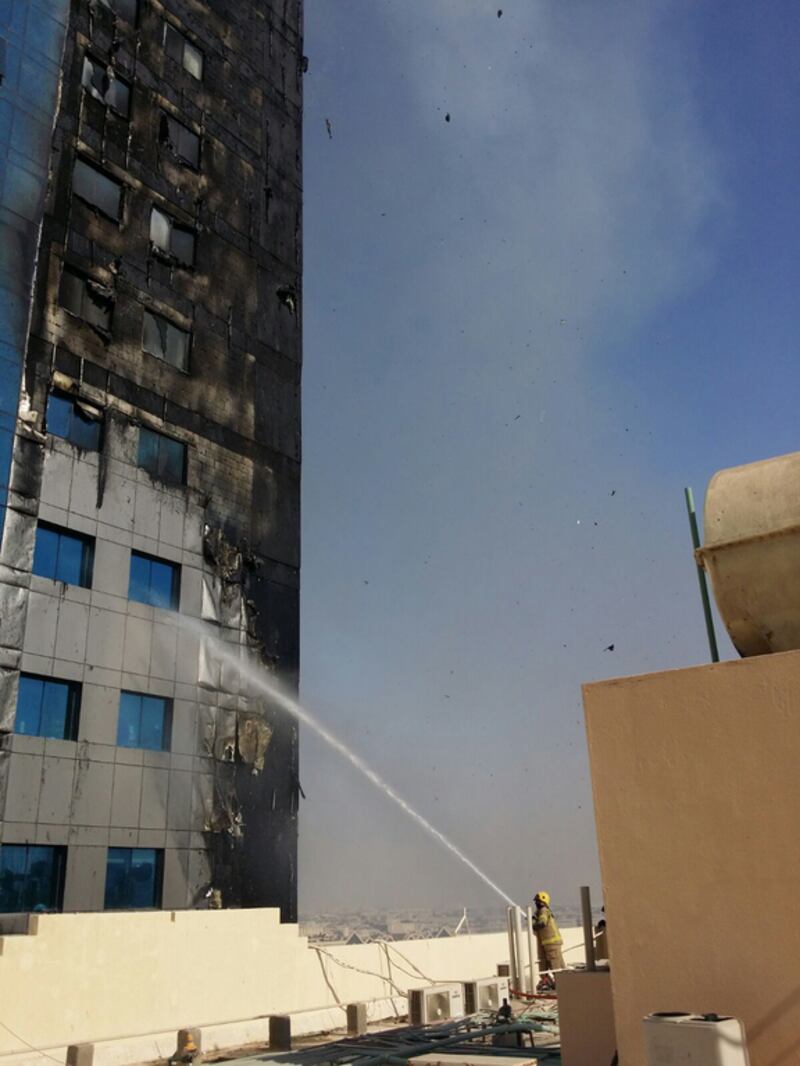 Residents were forced to flee their homes on Thursday after flames were seen spreading up outside their 32-floor tower block. Courtesy Sharjah Civil Defence