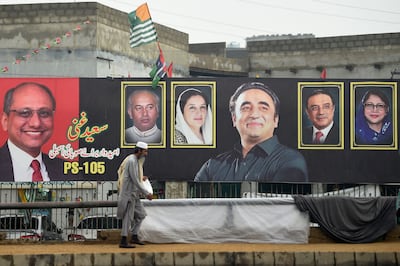 An election banner showing Bilawal Bhutto Zardari, centre, chairman of Pakistan People's Party, on a street in Karachi. AFP