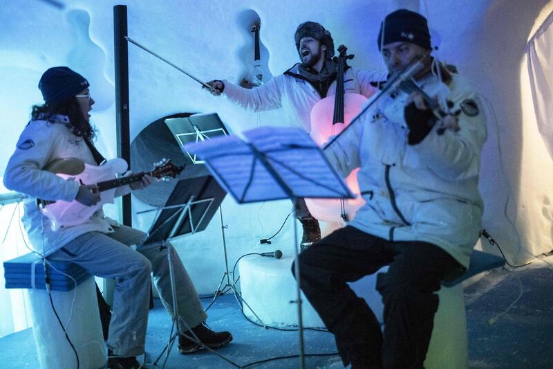 Musicians perform with ice instruments. AFP