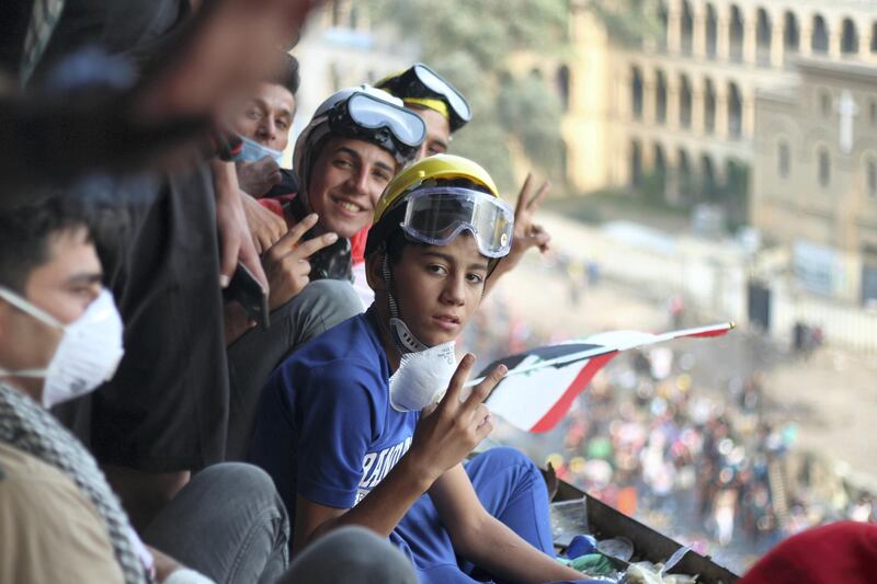 Hassan, 14, looks out at Jumhuriya bridge where he was protesting earlier in the day. Pesha Magid