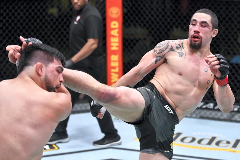 LAS VEGAS, NEVADA - APRIL 17: (R-L) Robert Whittaker of Australia kicks Kelvin Gastelum in a middleweight fight during the UFC Fight Night event at UFC APEX on April 17, 2021 in Las Vegas, Nevada. (Photo by Chris Unger/Zuffa LLC)