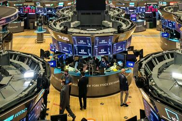 Traders on the floor of the New York Stock Exchange. Stocks around the world are tumbling on worries the worsening pandemic will mean more restrictions on businesses and drag down the economy. AP