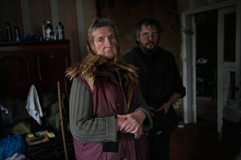 Nadiya Trubchaninova, 70, with her son Oleg Trubchaninov, 46, inside the room of her son Vadym, 48, who was killed by Russian soldiers on March 30 in Bucha. AP