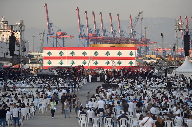 Families and relatives of victims of the explosion at Beirut port attend a Mass held to commemorate the  anniversary.