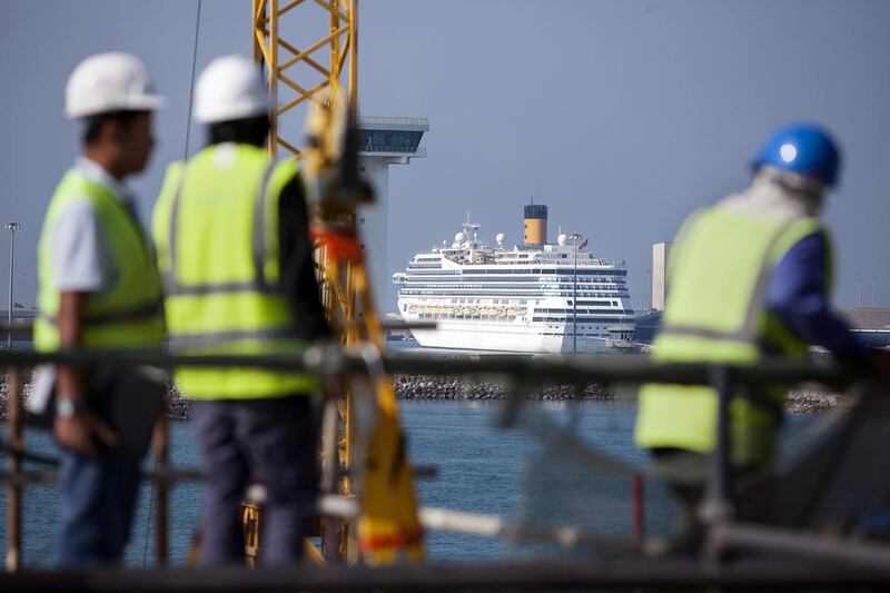 A cruise ship makes its way into the Abu Dhabi port Mina Zayed, as seen from the Louvre Abu Dhabi construction site. Silvia Razgova / The National