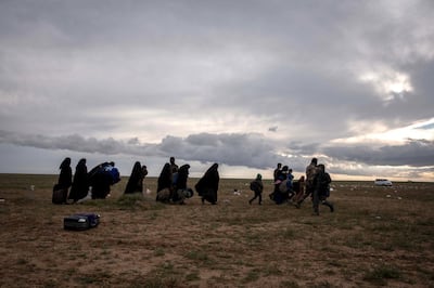 Civilians walk to be screened after fleeing from the last pocket of ISIS territoy in Baghouz, Syria, 28 February 2019. Campbell MacDiarmid