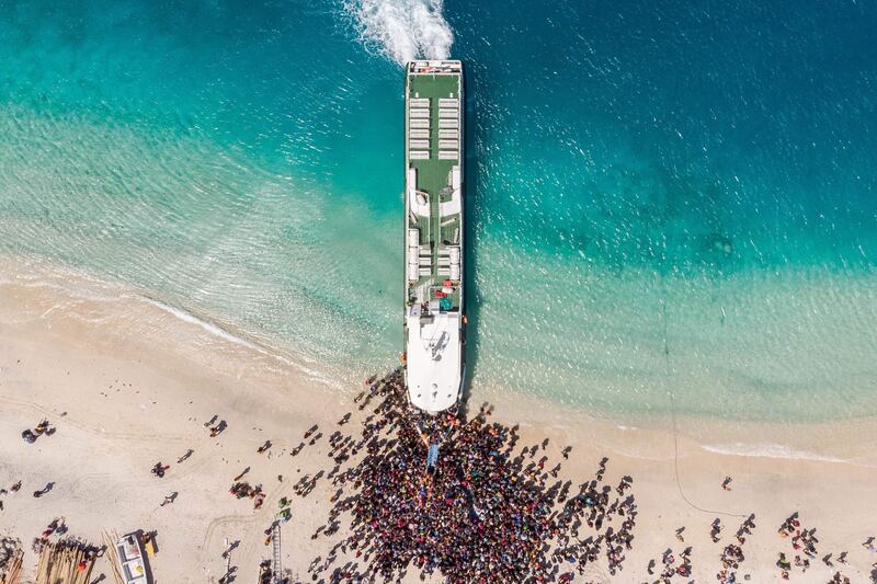 People crowding the beach as they wait to be evacuated from Gili Trawangan island to neighbouring Lombok island a day after a 6.9 magnitude earthquake struck the area. AFP