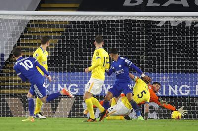 Leicester's James Maddison, left, scores against Brighton during the English Premier League soccer match between Leicester city and Brighton, at the King Power Stadium in Leicester, England, Sunday, Dec. 13, 2020. (Carl Recine/Pool via AP)