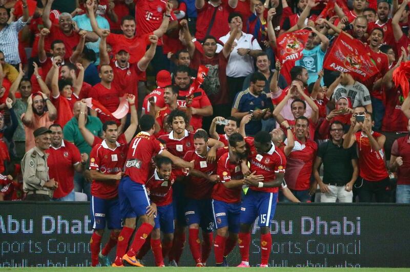 Al Ahly players celebrate after scoring a second goal during the Egyptian Super Cup at Hazza Bin Zayed Stadium in Al Ain on Thursday night.  AFP PHOTO / MARWAN  NAAMANI

