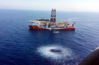 A helicopter flies over Turkish drilling ship Fatih as it sails towards Cyprus in the eastern Mediterranean to explore for natural gas. AP