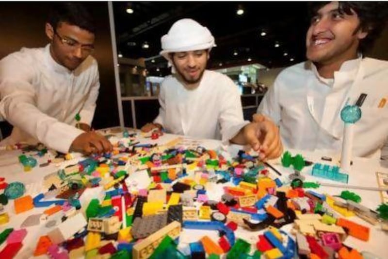 Job hunters build figures with Lego blocks at this week's Careers UAE exhibition to help them discover their strengths. Jaime Puebla / The National