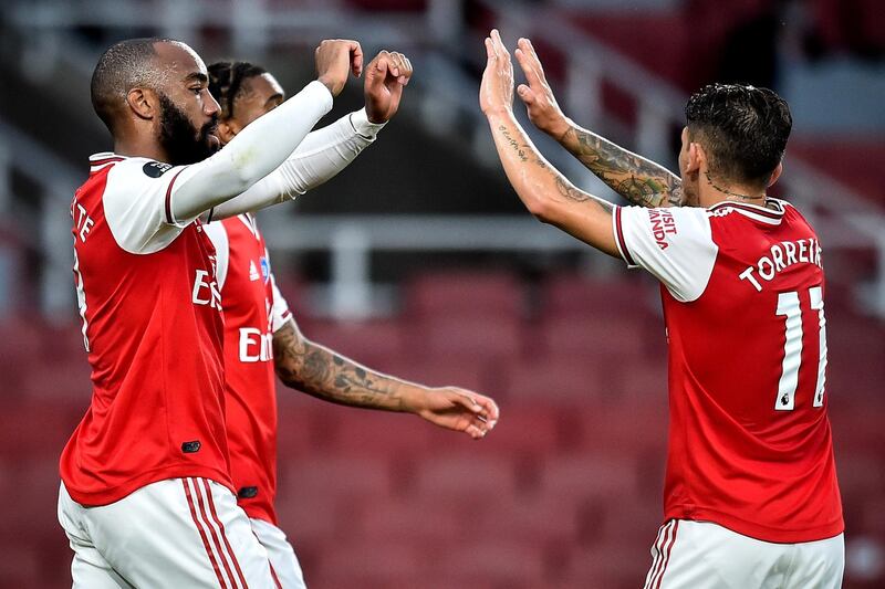 Arsenal's Alexandre Lacazette (L) celebrates with his teammates after levelling the scores. EPA