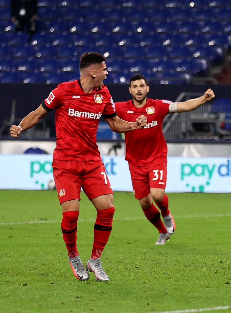 Paulinho, of Bayer Leverkusen, celebrates after Schalke's Juan Miranda's own goal made the score 1-1. Getty