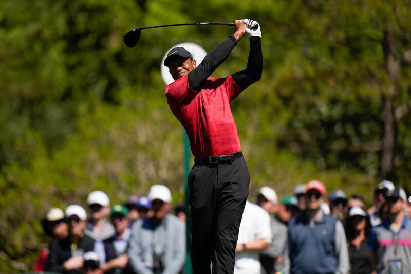 Tiger Woods tees off on the fifth hole during the final round at the Masters golf tournament on Sunday.  AP