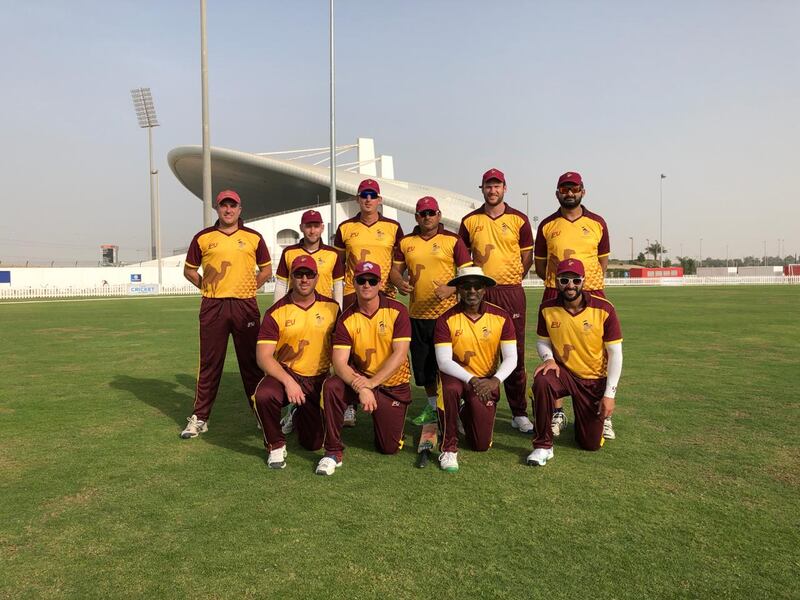 Members of the Abu Dhabi Gentlemen’s Cricket Club in their yellow-and-maroon kit at the Sheikh Zayed Cricket Stadium. Courtesy Abu Dhabi Gentlemen’s Cricket Club
