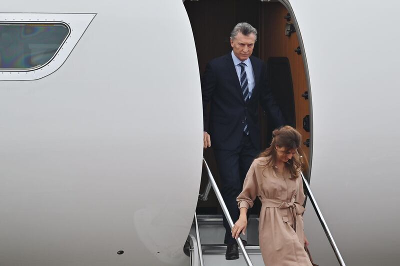 Argentine President Mauricio Macri and First Lady Juliana Awada disembark.  AFP